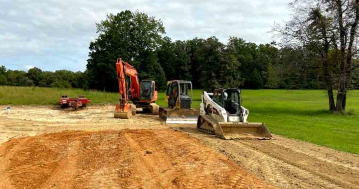 Skid steer loaders preparing the site for construction