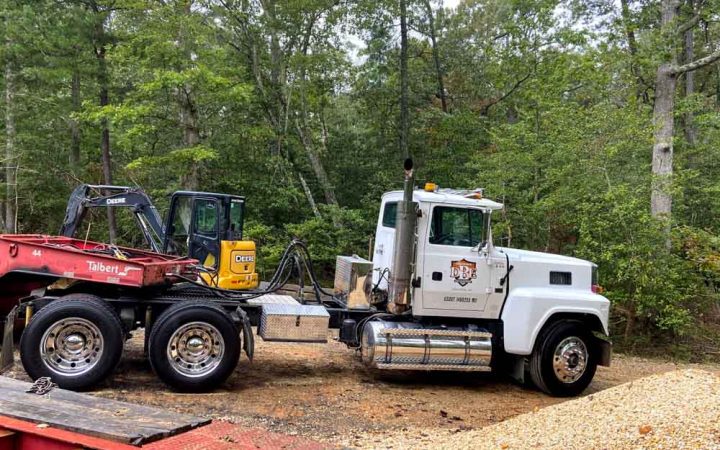 excavation trailer truck parked at the construction site