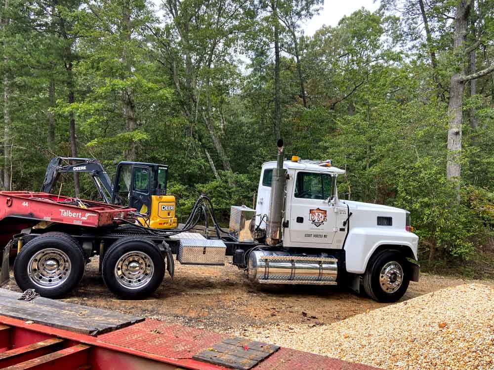 excavation trailer truck parked at the construction site